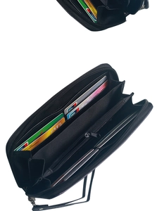 Interior view of black skull wallet showing card slots, zipper pocket, and leather texture
