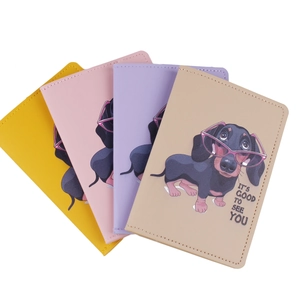 Colorful PU leather passport covers featuring cartoon dachshund prints and text detail