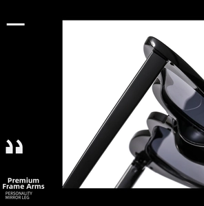 Detail view of smooth polished black temple arm on stylish heart-shaped sunglasses