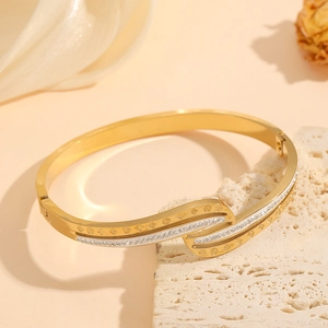 18K gold plated titanium bangle featuring double-row zircons and flower engravings