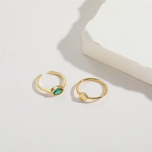 Adjustable gold ring set featuring oval green zircon and minimalist flat round design
