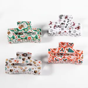 Christmas hair claws 4-pack featuring festive Santa Claus and reindeer patterns