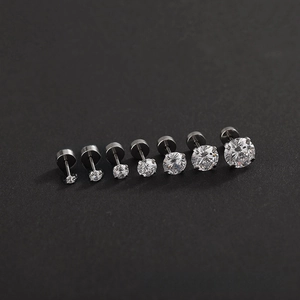 Detailed view of varying sizes of shiny cubic zirconia flat back titanium stud earrings