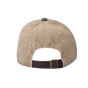 Detail of adjustable leather strap and bronze buckle on washed cotton baseball cap