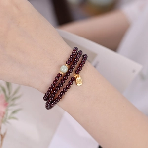 Three-wrap natural garnet and Hetian jade beaded bracelet with lucky gold pendant charm