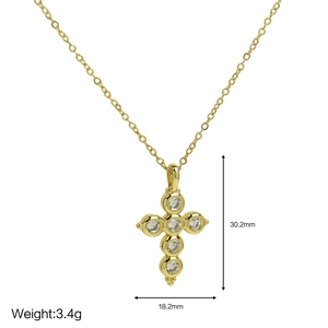 Detail view of 18k gold cross pendant necklace with measurements 30.2mm by 18.2mm