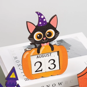 Detail of wooden Halloween countdown calendar featuring a black cat in a pumpkin design