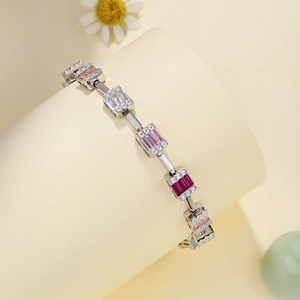 Macro shot of silver bracelet with colorful rectangular cubic zirconia in step-cut style