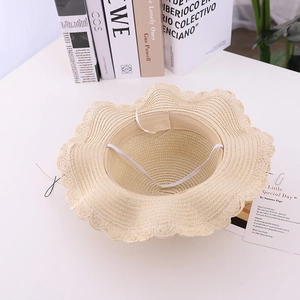 Kids beige woven straw sun hat with wavy brim and white windproof rope for girls