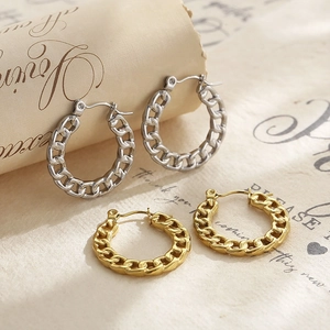 Gold and silver Cuban link chain hoop earrings in a vintage minimalist aesthetic