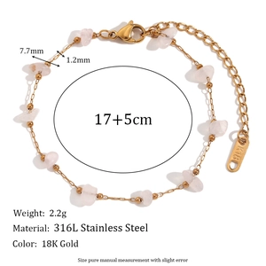 Macro detail of 18K gold plated stainless steel bracelet with pink quartz stone accents