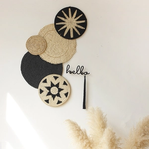 Boho Nordic rattan wall decor set with five woven plates and a black hello wall hook