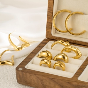 Retro minimalist semi-circle gold-plated titanium steel earrings in a wooden jewelry box