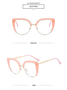 Detail view of pink cat-eye semi-rimless glasses with gold metal and nose pads