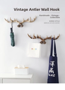 Detail of vintage antler wall hooks in resin with lifelike texture for hanging coats