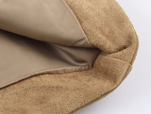 Detailed macro view showing the camel suede exterior and smooth satin lining texture