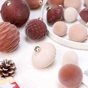 Red and beige flocked velvet Christmas ornaments set in various shapes for tree decoration