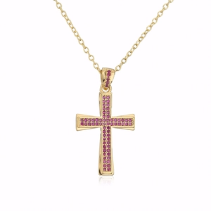 Close-up of 18K gold plated cross necklace with vibrant pink round zircon stones