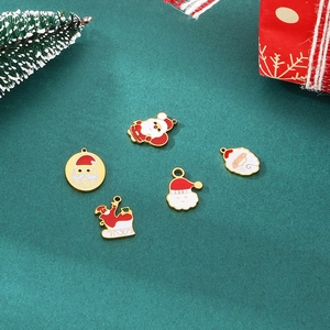 Cartoon Christmas enamel charms set with Santa Claus and sleigh on green background