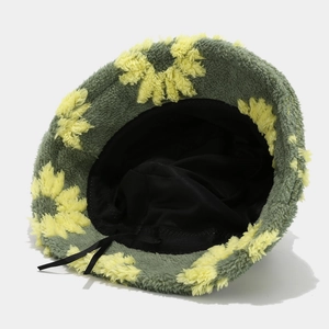 Women's plush bucket hat with green flower pattern and adjustable inner ribbon