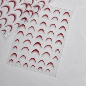 Macro shot of French gradient burgundy nail stickers for DIY manicure art on transparent sheets