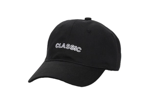 Detailed close-up of a black cotton baseball cap featuring white CLASSIC embroidery