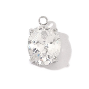 Macro shot of oval clear gemstone pendant with silver four-prong setting and jump ring