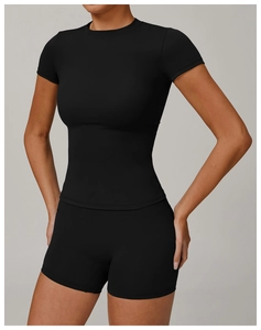 Close-up of black yoga set featuring a tight short-sleeve top and high-waist shorts