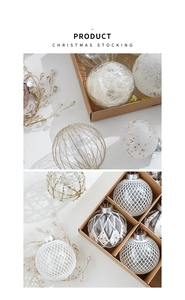 Detail of 8cm white Christmas ornaments with glitter and mesh textures in a kraft box