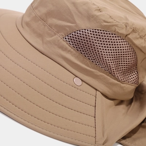 Macro detail of breathable brown mesh and reinforced stitching on khaki sun hat