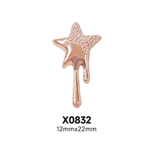 Macro detail of rose gold star nail charm with matte texture and size dimensions
