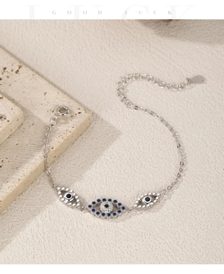 Detail of S925 silver evil eye bracelet with blue zircon charms and adjustable chain