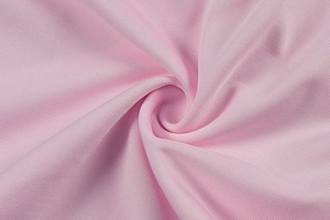 Close-up of pink V-neck top showing soft twill fabric texture and delicate ribbing