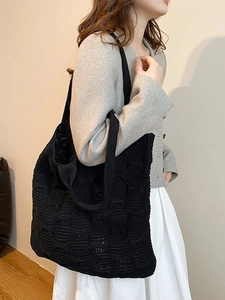 Large capacity black knit shoulder bag with hollow mesh texture for casual travel