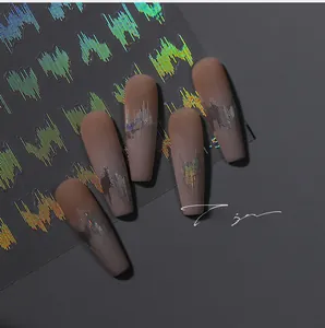 Macro detail of laser holographic nail stickers featuring metallic flame line patterns
