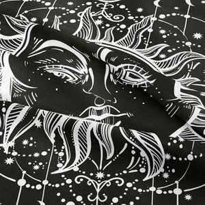 Close-up of bohemian sun and moon tapestry fabric showing fine weaving and white lines
