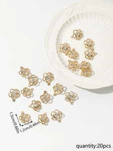 Detailed view of 20pcs gold flower charms with sparkling zircons for DIY jewelry making