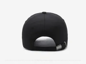 Close-up of black baseball cap back with adjustable silver metal buckle and breathable fabric