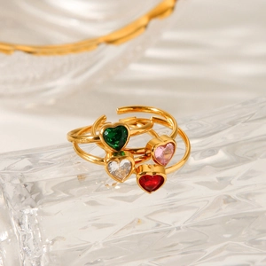 Macro shot of 18k gold plated open heart rings with colorful zircon gemstones
