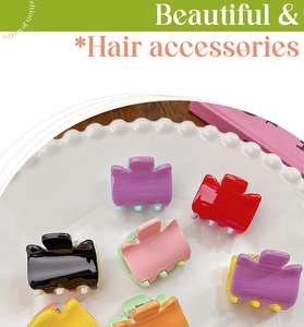 Close-up of candy-colored mini hair claws in a white porcelain dish with bright lighting