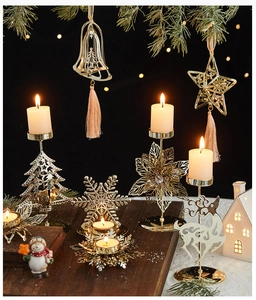 Golden iron Christmas bells and star ornaments with warm bokeh background