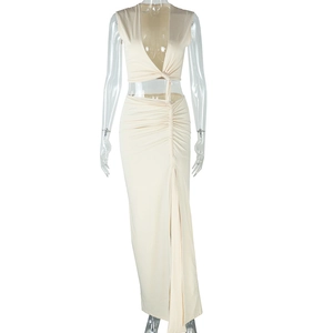 Detail of beige V-neck sleeveless crop top and side slit maxi skirt set with ruched texture
