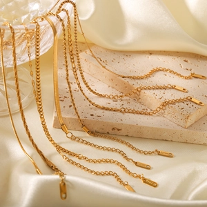 18K gold plated stainless steel chain collection including snake and figaro link styles