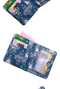 Detailed interior view of blue skull print bifold wallet with card slots and ID window