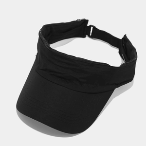 Detail of black sports visor featuring reinforced brim stitching and unique zipper pocket structure