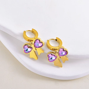 Golden bow drop earrings with purple heart-shaped crystals and ribbon detail