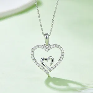Elegant S925 sterling silver heart-in-heart pendant necklace with shimmering moissanite