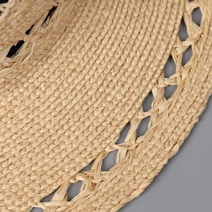 Fashionable hollow hand-woven straw hat with wide brim for outdoor beach and summer travel