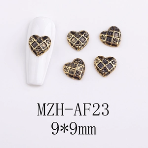 Detailed view of 9x9mm heart-shaped alloy nail charms with vintage gold checkered pattern