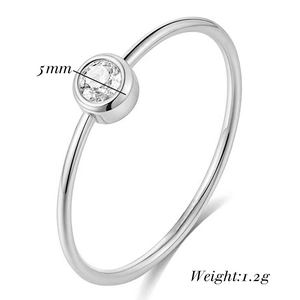 Detail shot of 2mm stainless steel solitaire ring with a 5mm cubic zirconia inlay